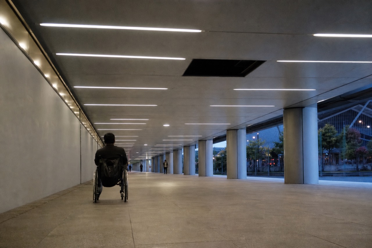 Covered walkway leading toward the Kuala Lumpur Convention Centre, no text, no logos, no people