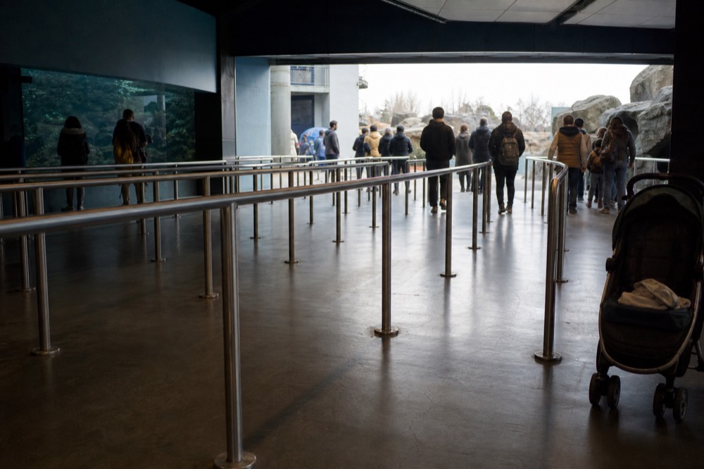 A ticket counter queue barrier at an aquarium entrance, no text, no logos, no people