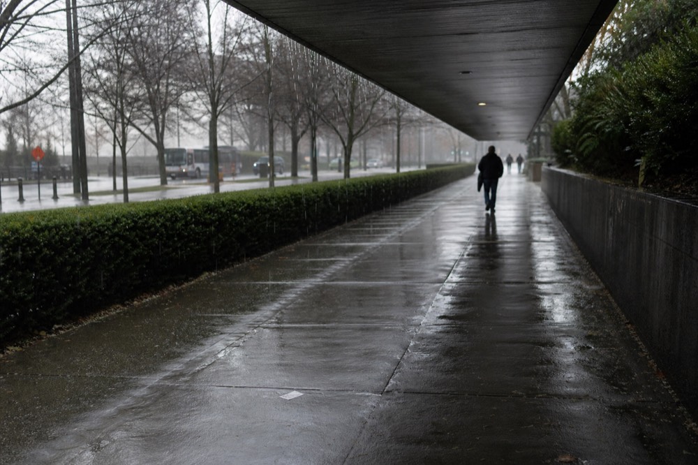 Covered walkway and landscaped path leading toward the Kuala Lumpur Convention Centre, no text, no logos, no people
