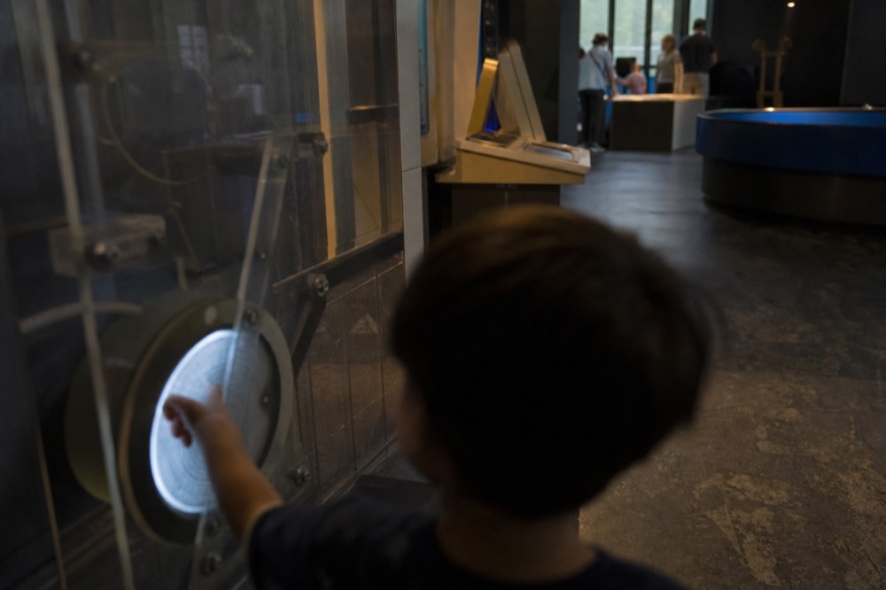 A hands-on science exhibit hall with interactive displays, no text, no logos, no people