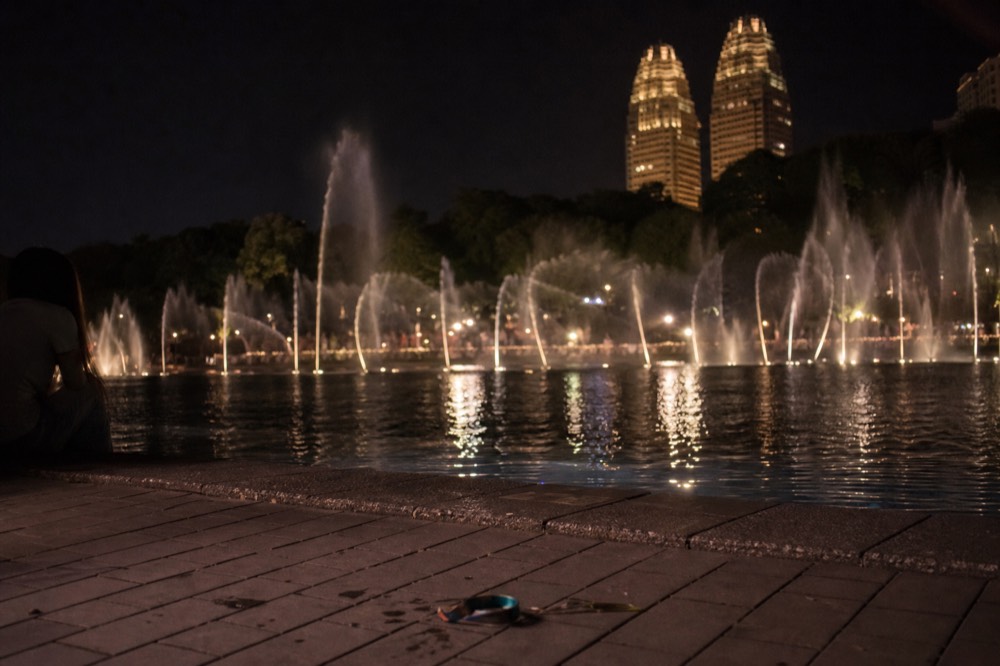 KLCC Lake Symphony fountain show at night, no text, no logos, no people